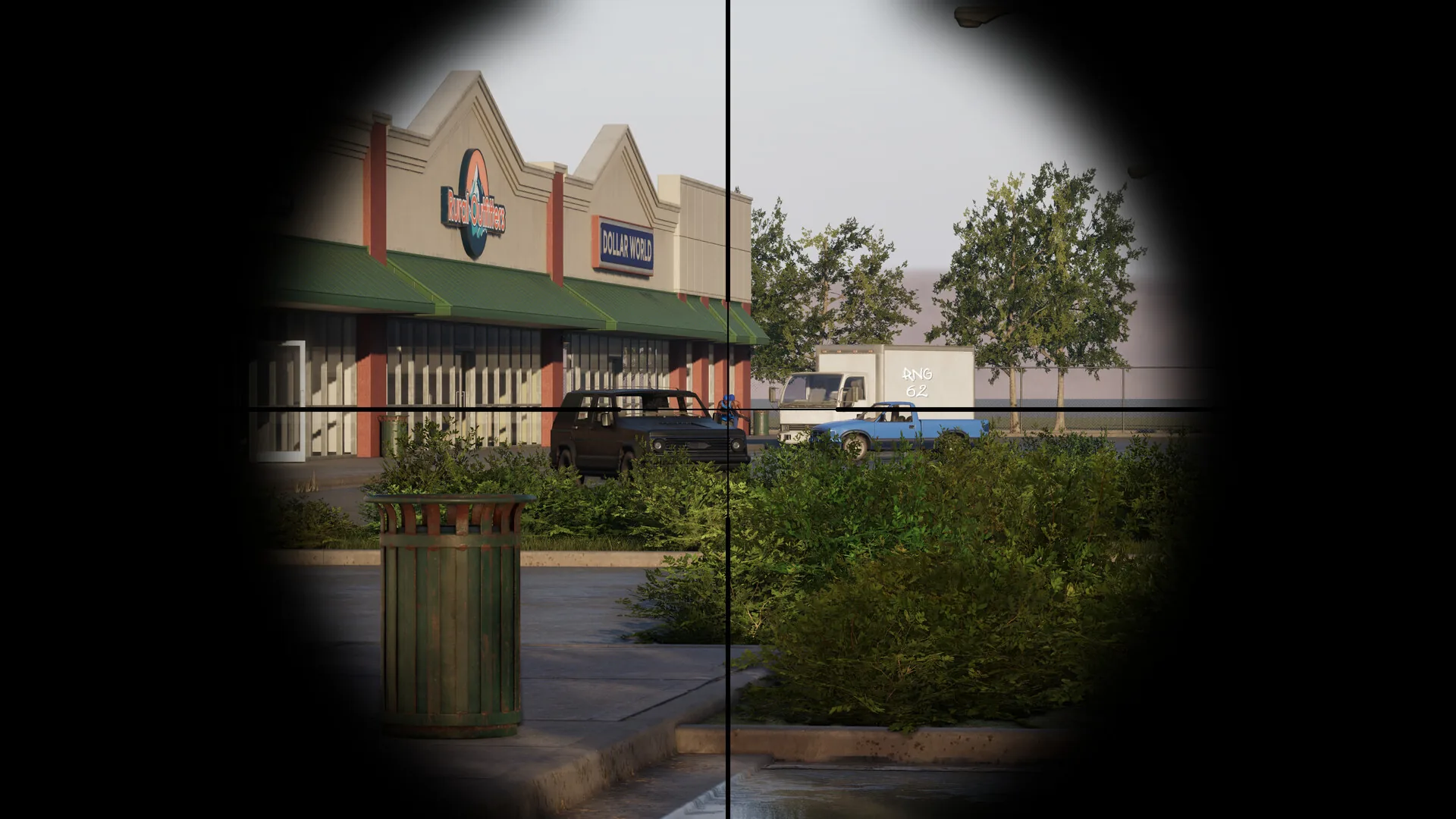 Scoped view centered on storefronts and parked vehicles